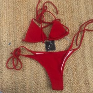 Little red bikini.  Never worn. Still has hygiene protector.